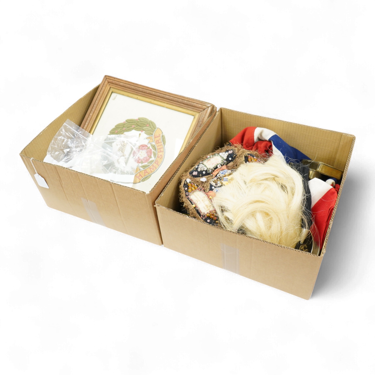 A collection of militaria, etc. including; a Gordon Highlander’s kilt and sporran, three early 20th century Union Flags, a Victorian beaded ‘sweetheart’s’ cushion, two empty First World War Princess Mary Christmas tins,